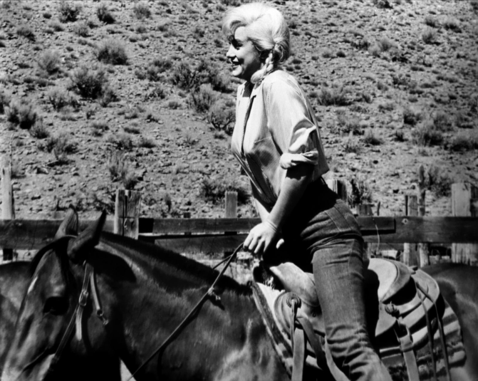 Marilyn Monroe riding a horse during the filming of The Misfits